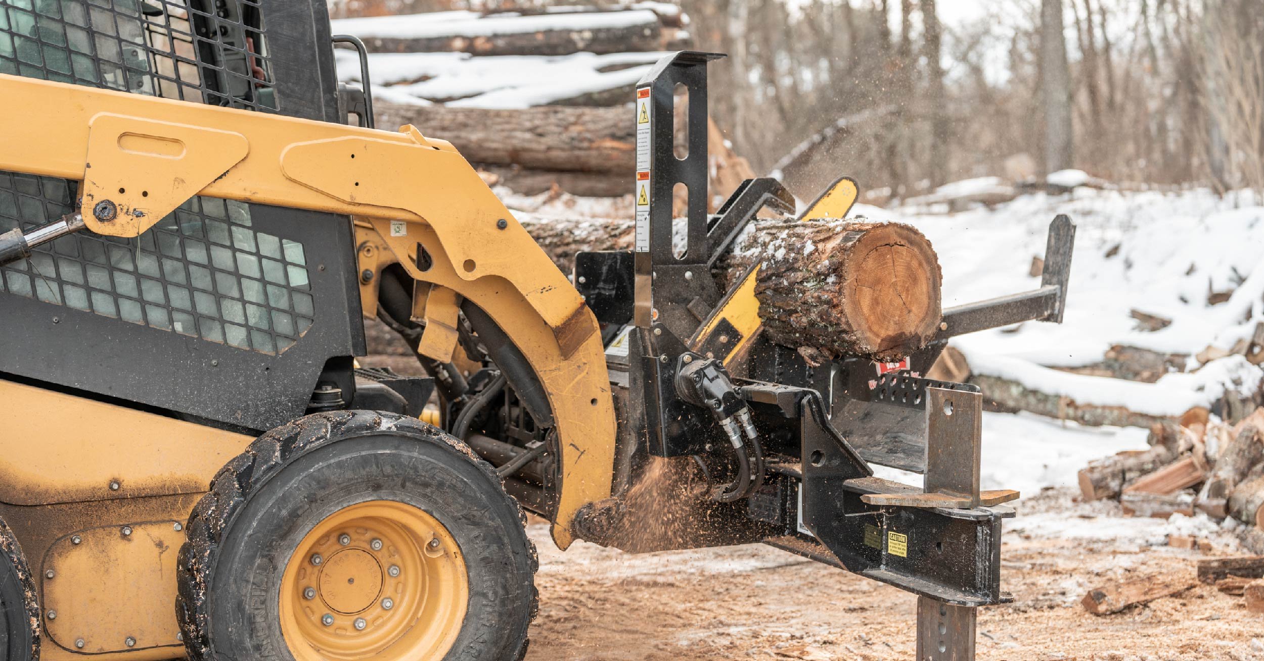 Halverson 150 firewood processor on a CAT skid steer