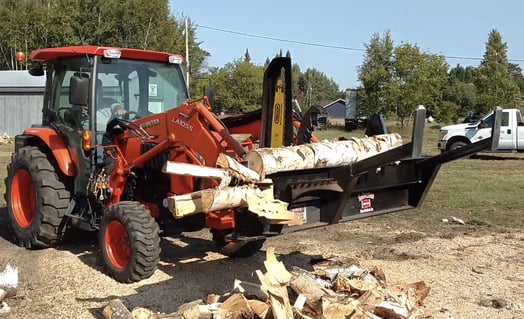 A Halverson firewood processor processes a log.